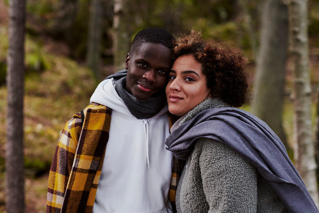 Portrait of young couple in forest