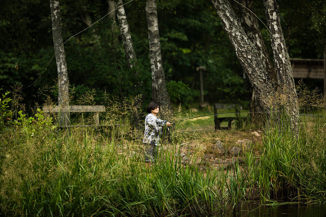 View of boy fishing