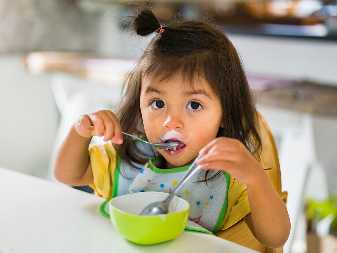 Girl eating at table