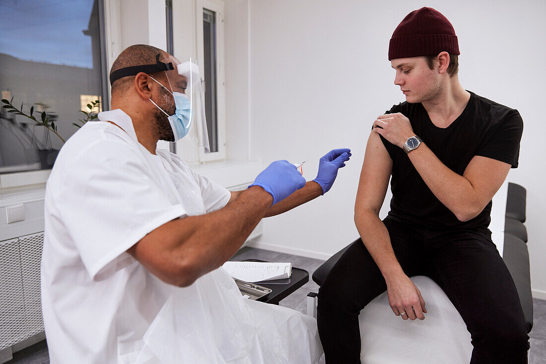 Young man getting vaccinated against Covid-19