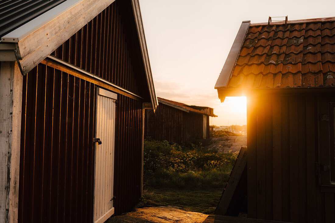 Old wooden sheds at sunset