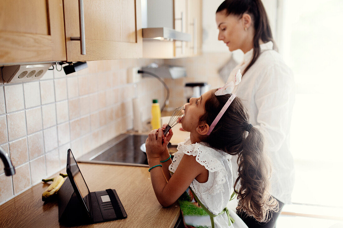 Mother and daughter in kitchen