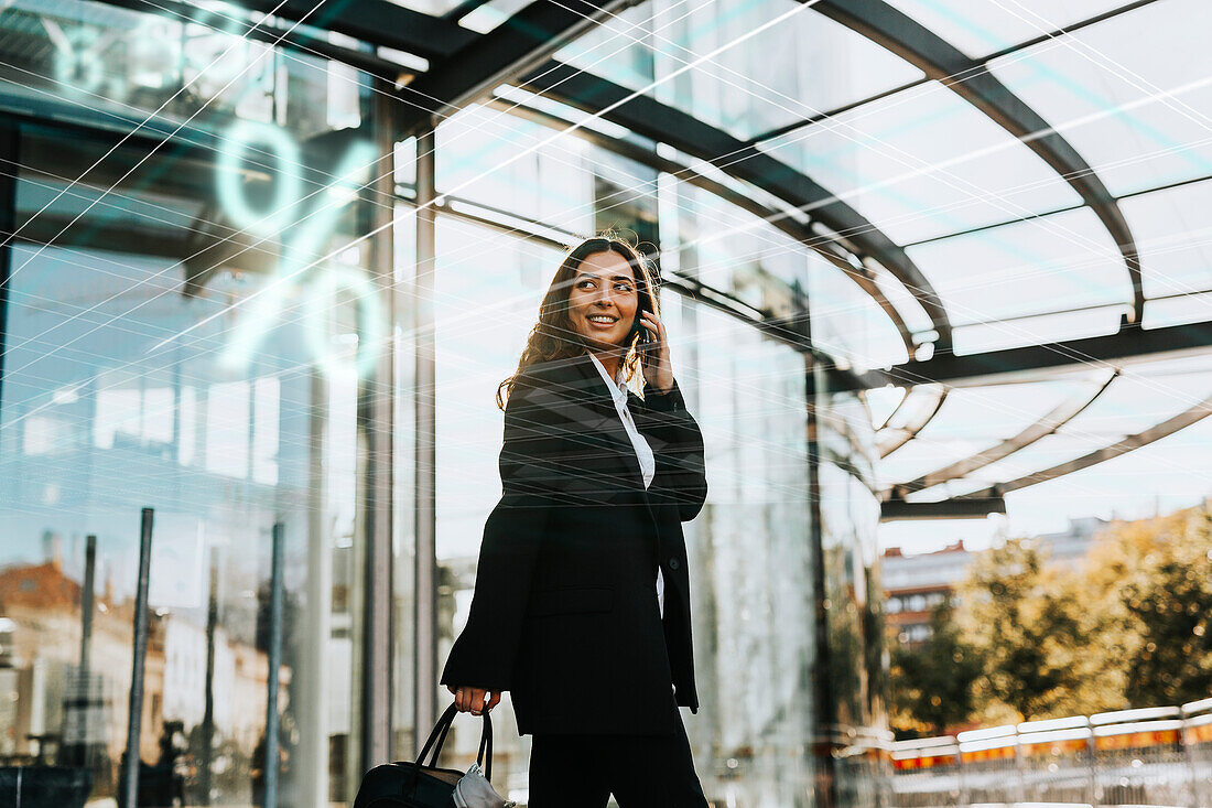 Smiling businesswoman talking on phone