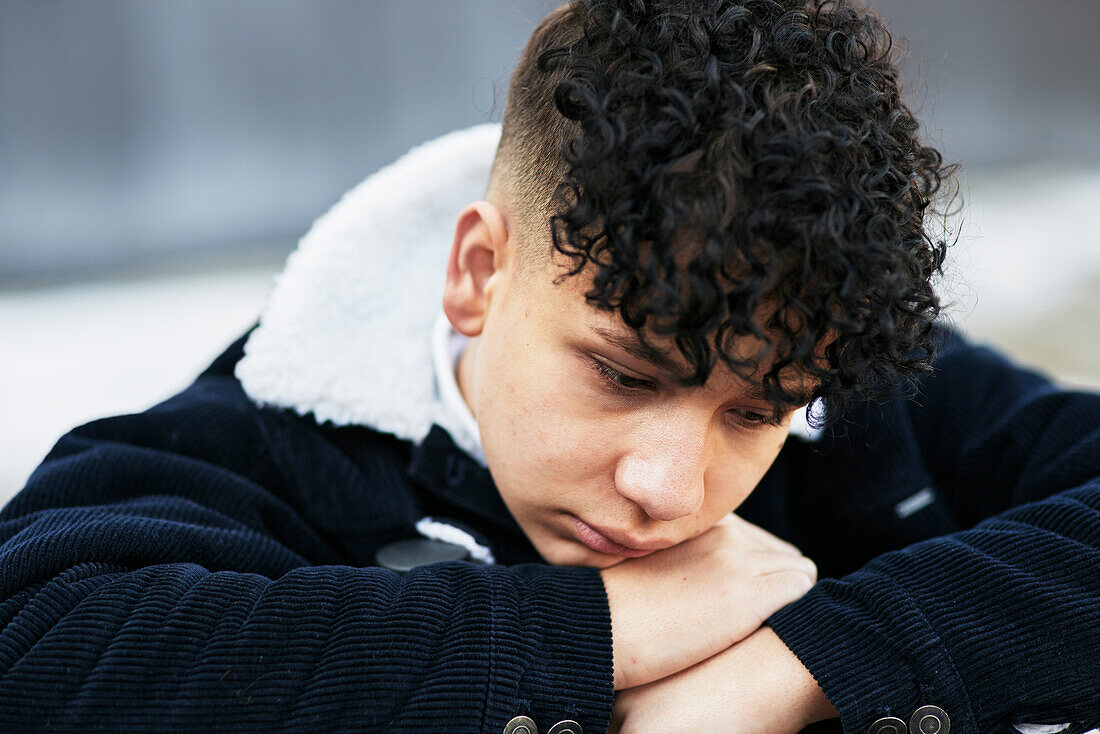 Teenage boy looking away