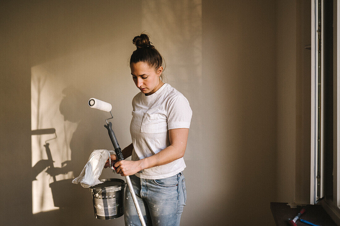 Woman painting room