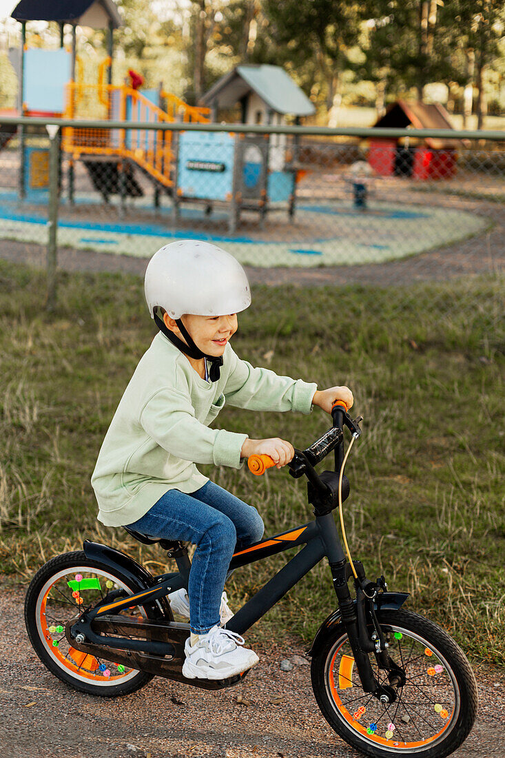 Smiling child cycling