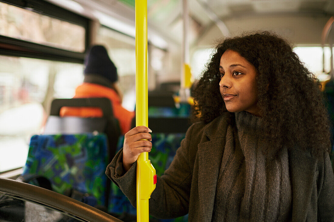 Woman in bus looking away