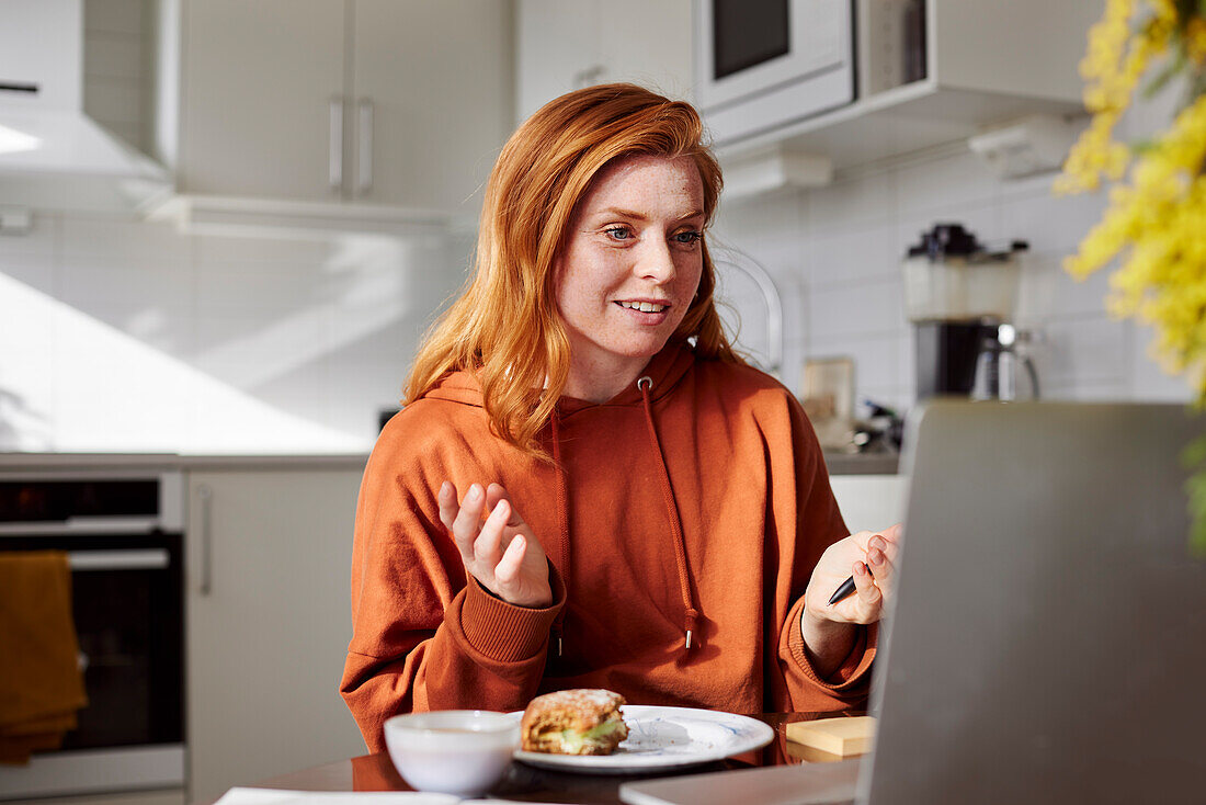 Woman using laptop at home