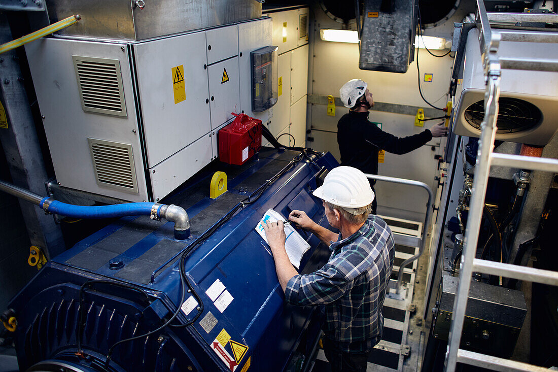 Engineers working in wind turbine