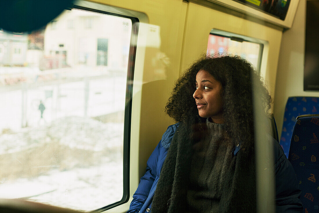Woman in train looking away