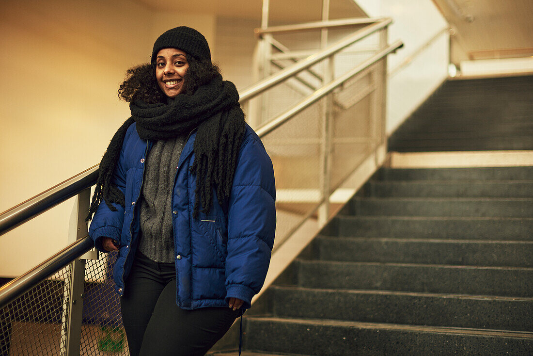 Smiling woman at train station