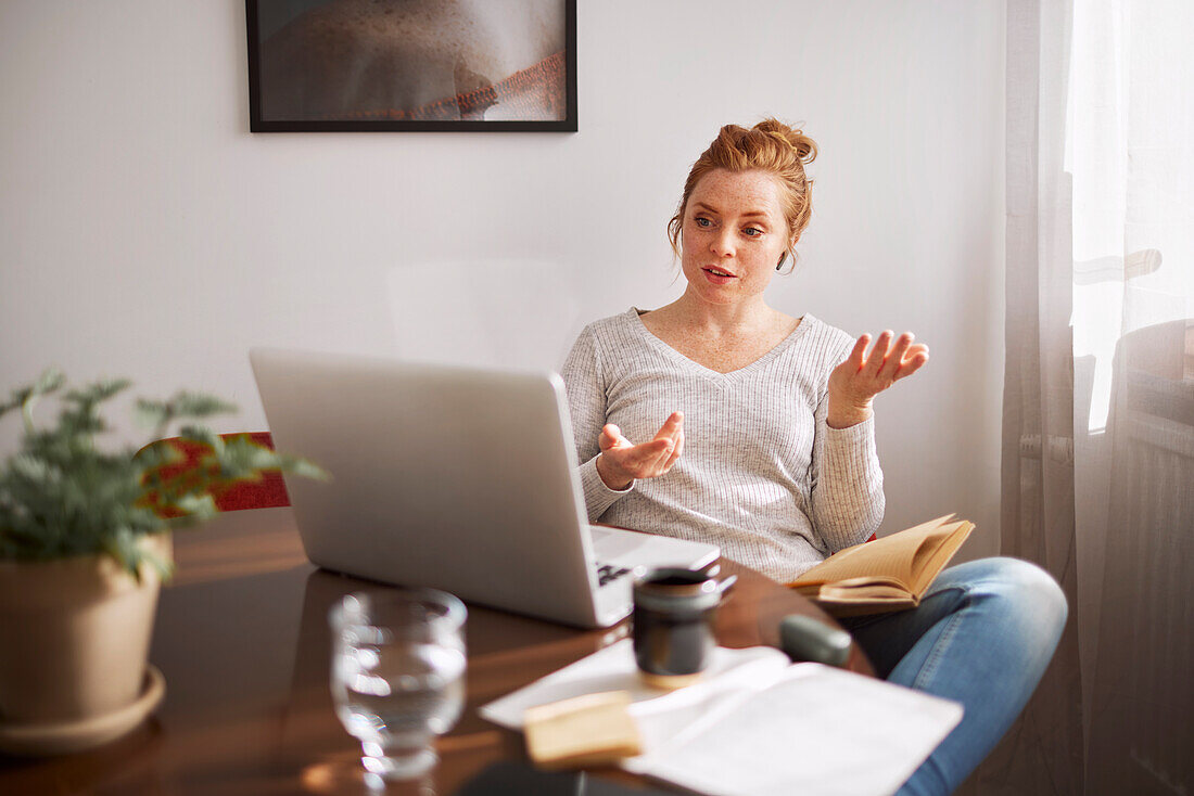 Woman using laptop at home