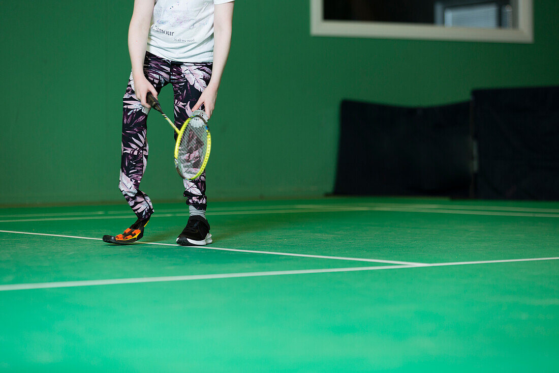 Girl with artificial leg playing badminton