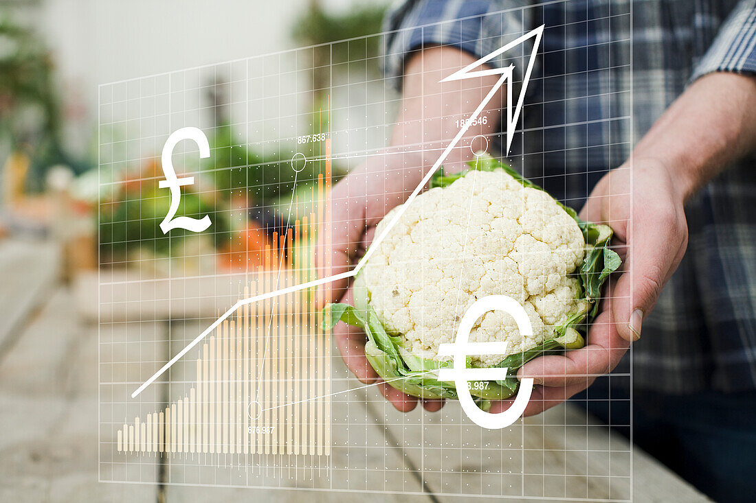 Finanzdiagramm und Mann mit Blumenkohl in der Hand