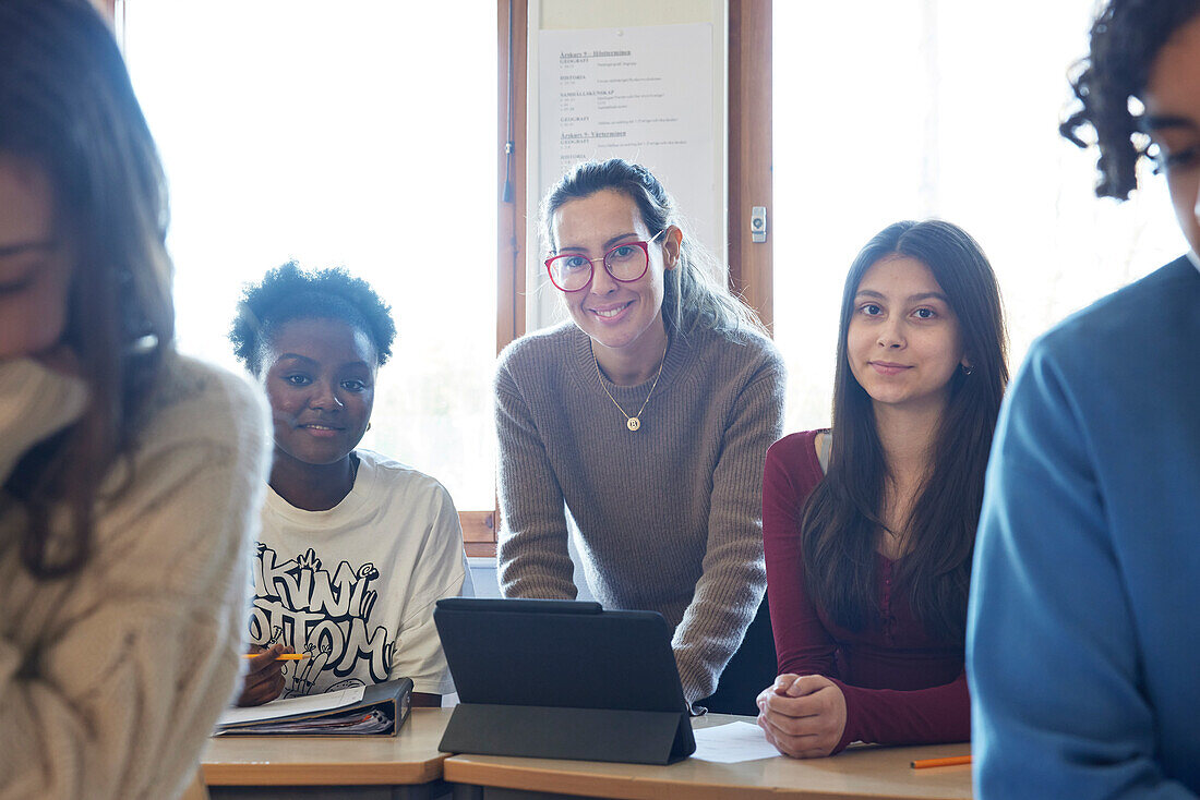 Female teacher and students in class