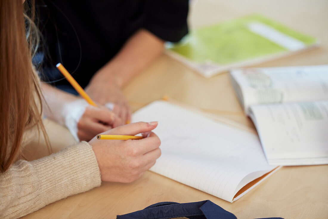 Students taking notes in class