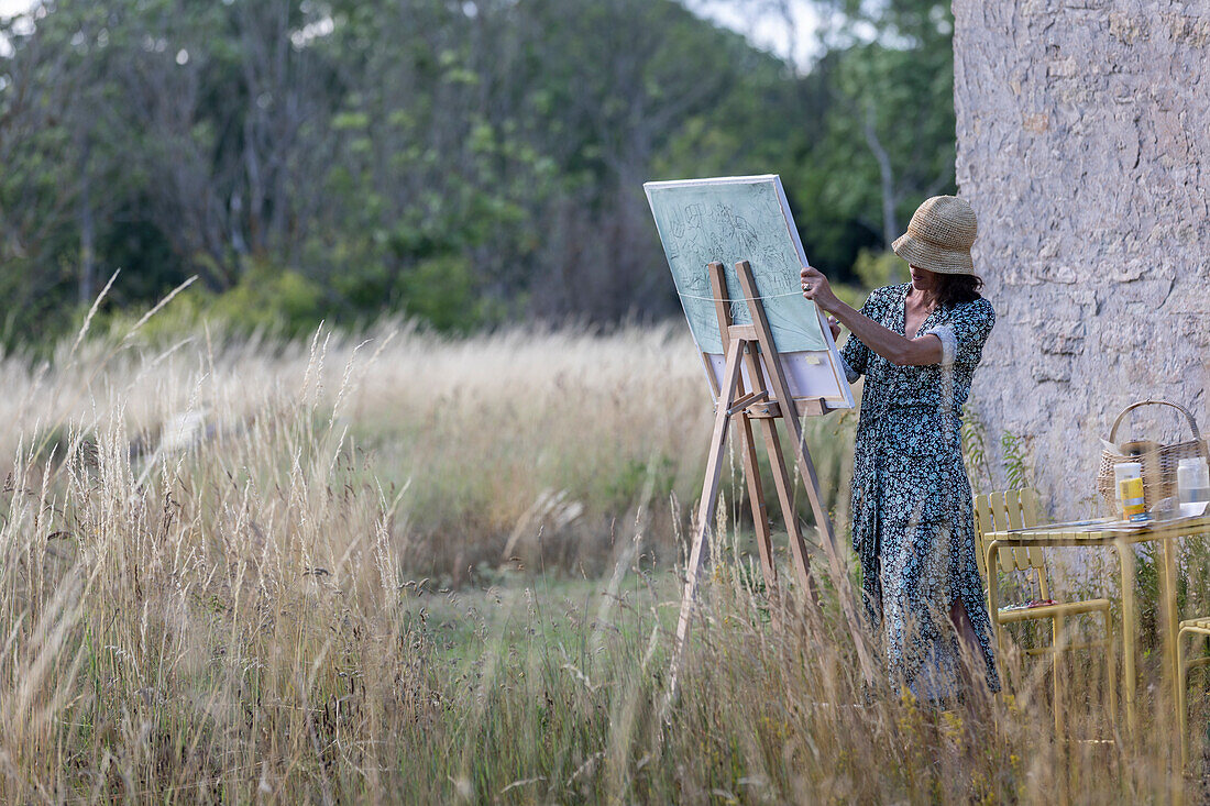 View of woman painting outdoor