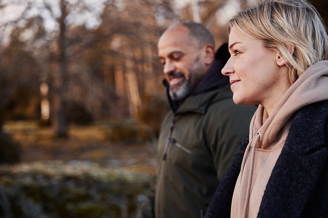 Couple walking in forest