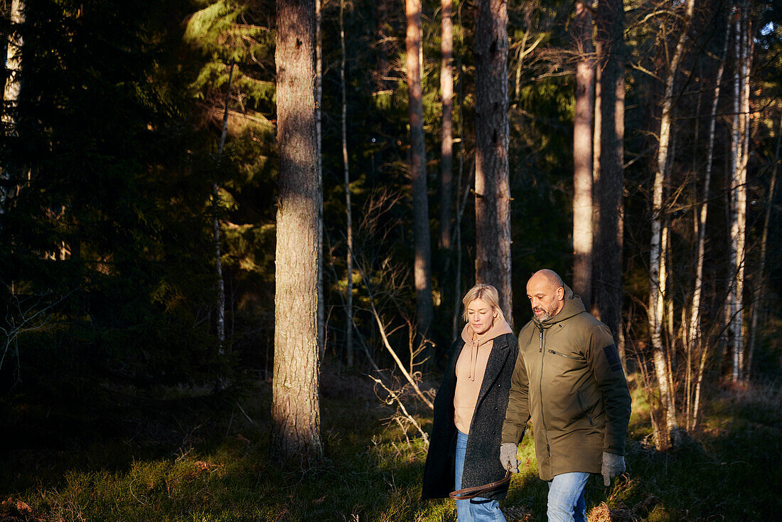 Couple walking in forest