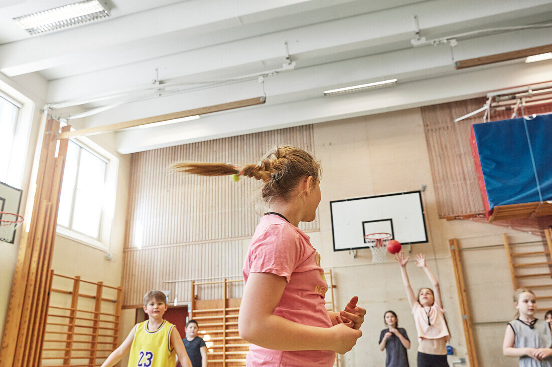 Children having PE class in school gym