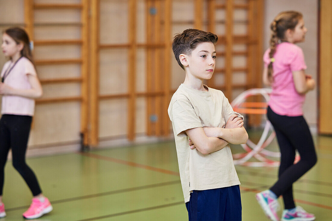 Children having class in school gym