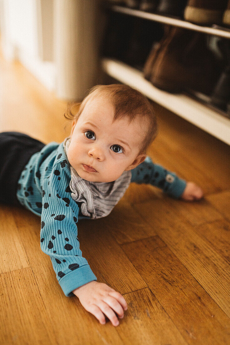 Baby crawling on floor