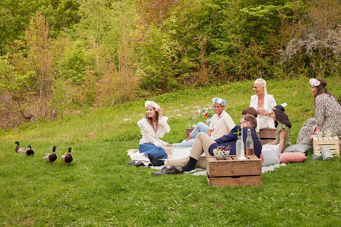 Family having picnic and looking at ducks