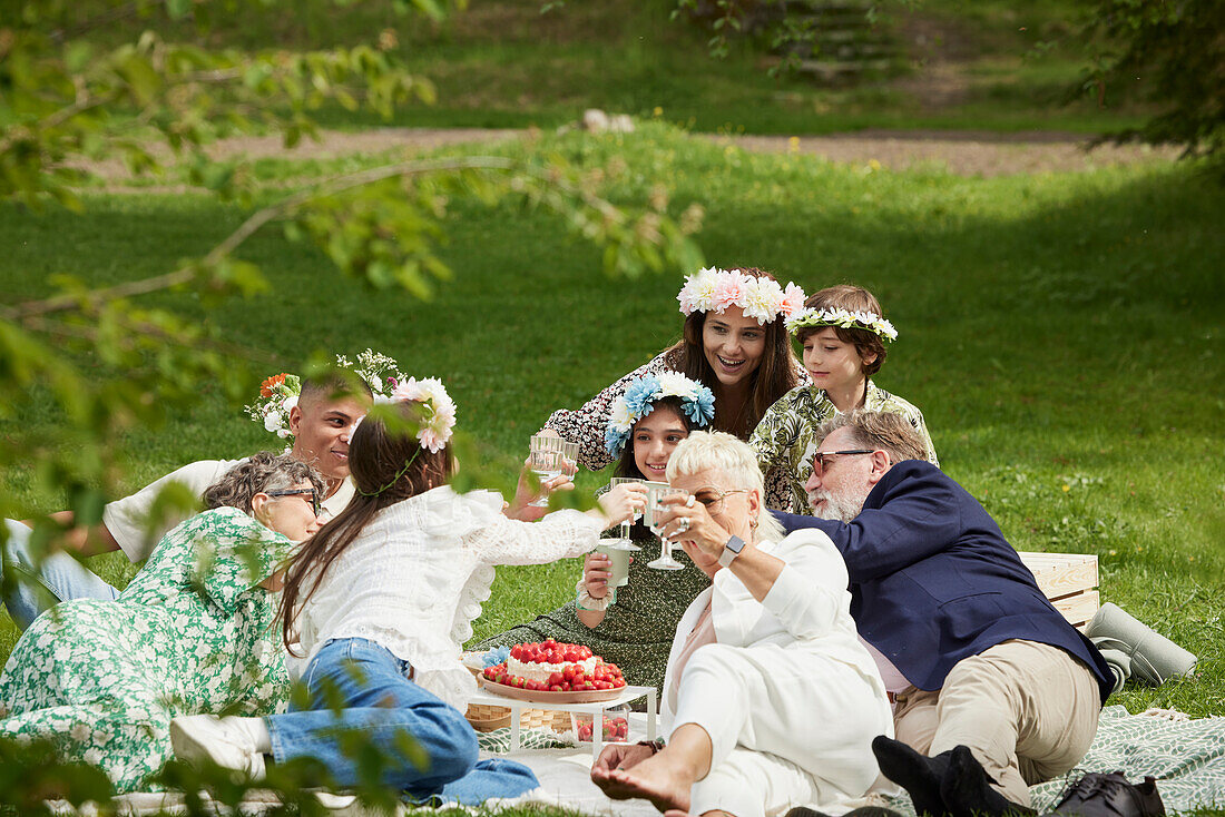 Family having picnic during midsummer