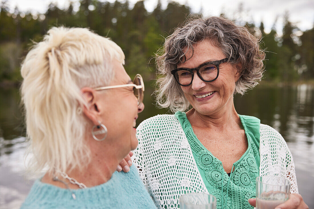 Smiling women talking together