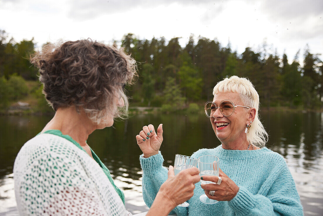 Smiling women talking together