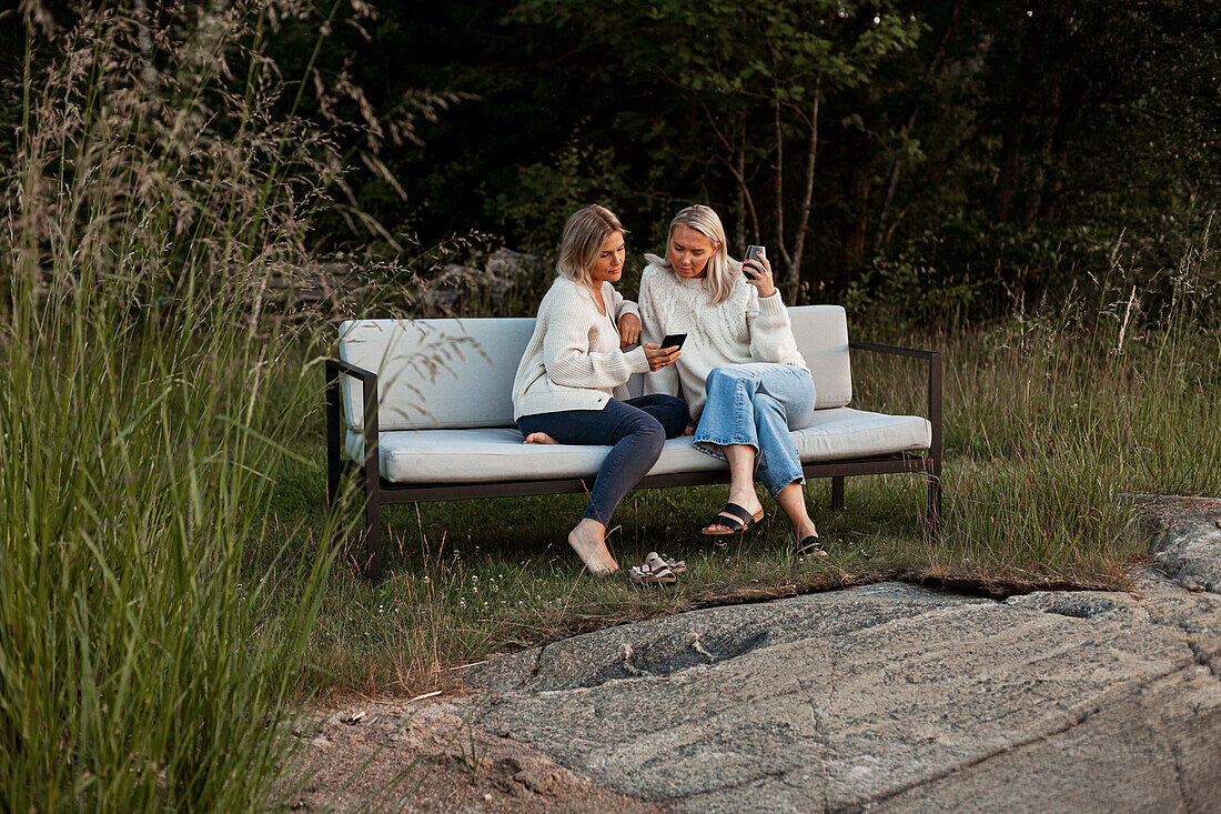 Female friends sitting on bench