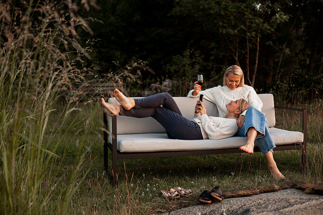 Female friends sitting on bench