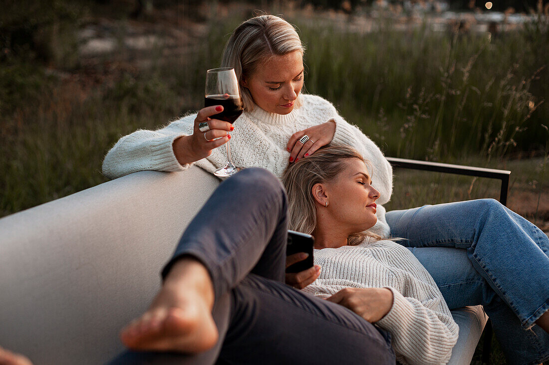 Female friends sitting on bench