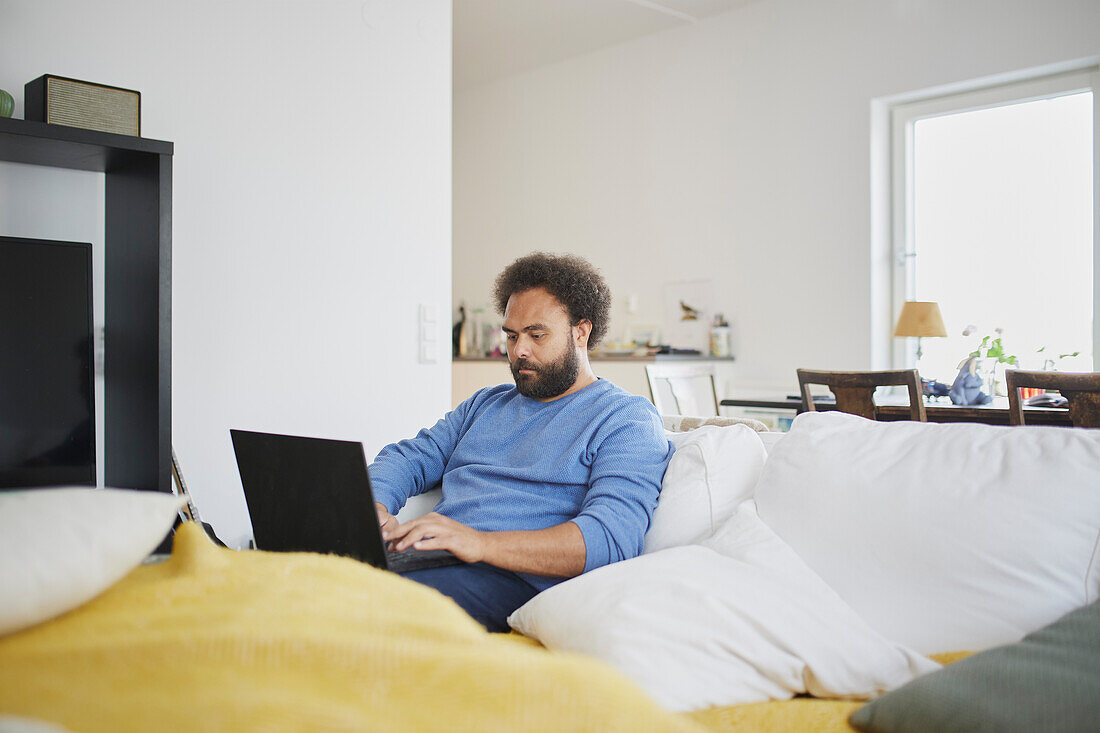 Man working on laptop from home