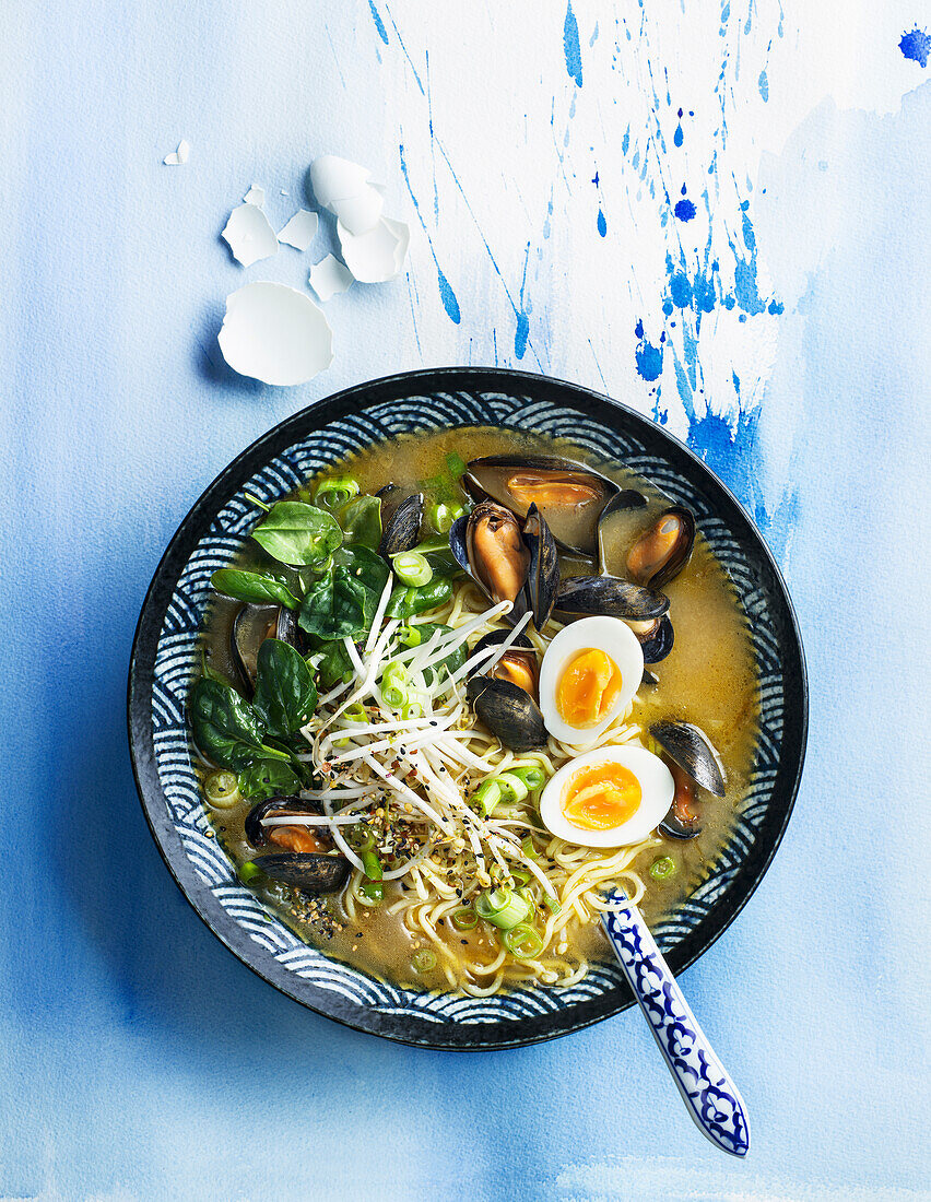 Soup with sprouts and mussels