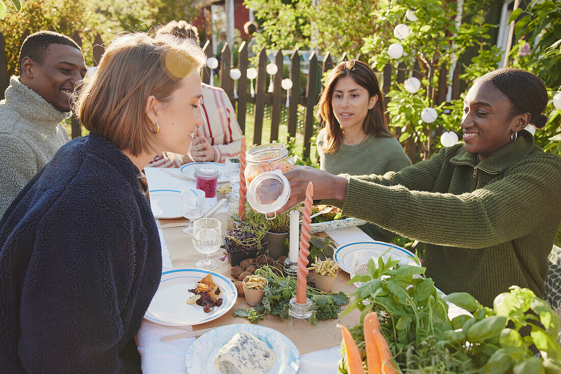 Friends having meal in garden