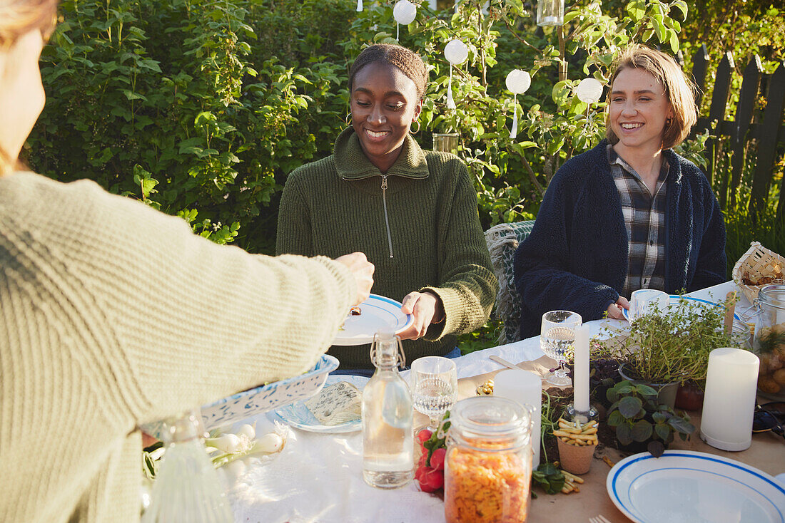 Friends having meal in garden