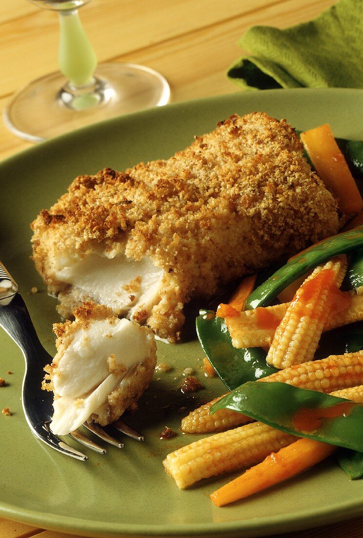 Baked cod fillets with breadcrumb crust and vegetable