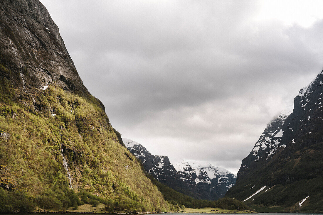 Woman travelling by ferry in fiord