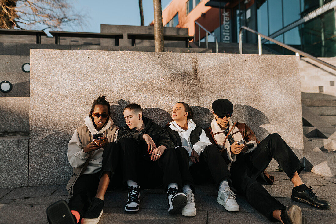 Young friends sitting together