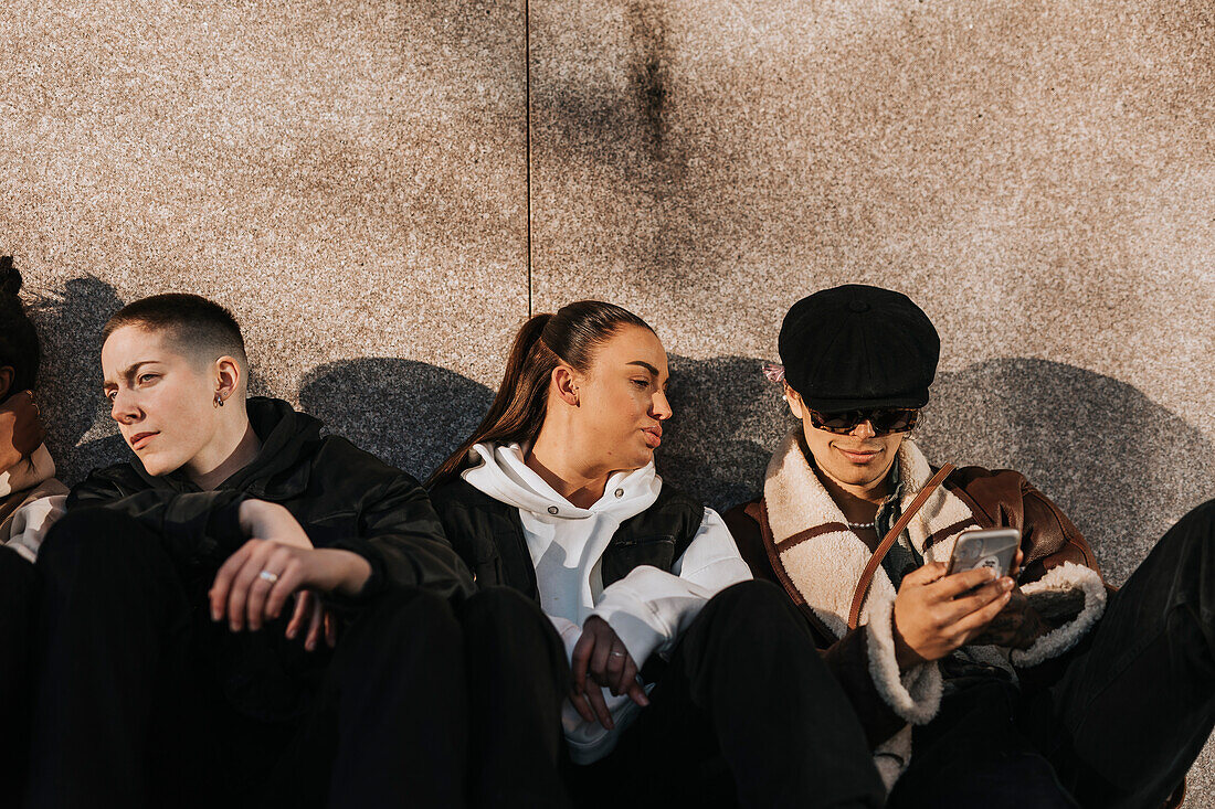 Young friends sitting together