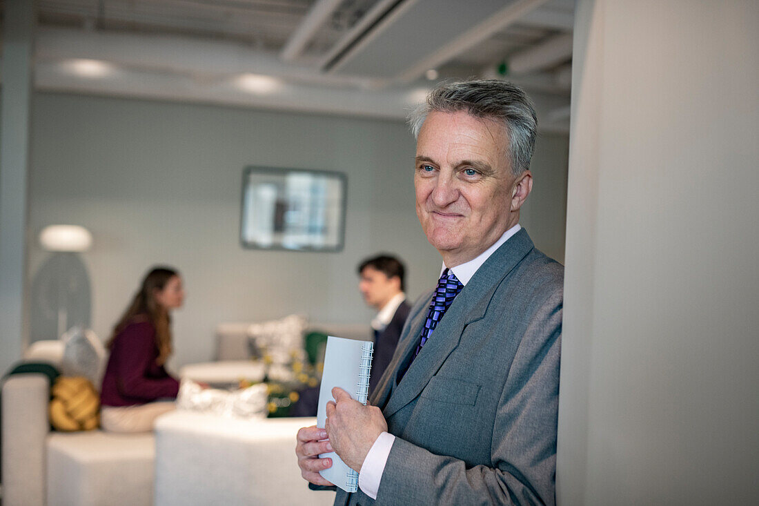 Businessman in office looking away