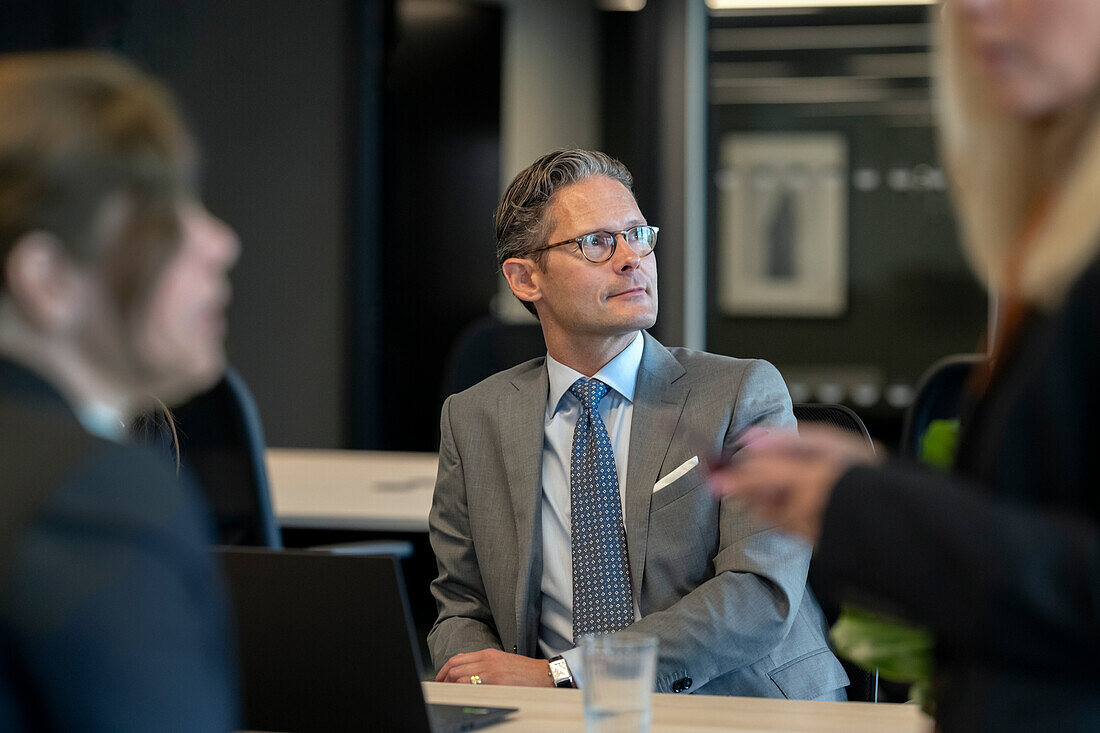 Businessman in office looking away