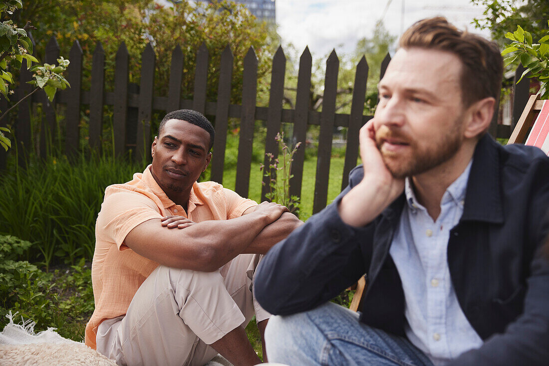 Men sitting in garden