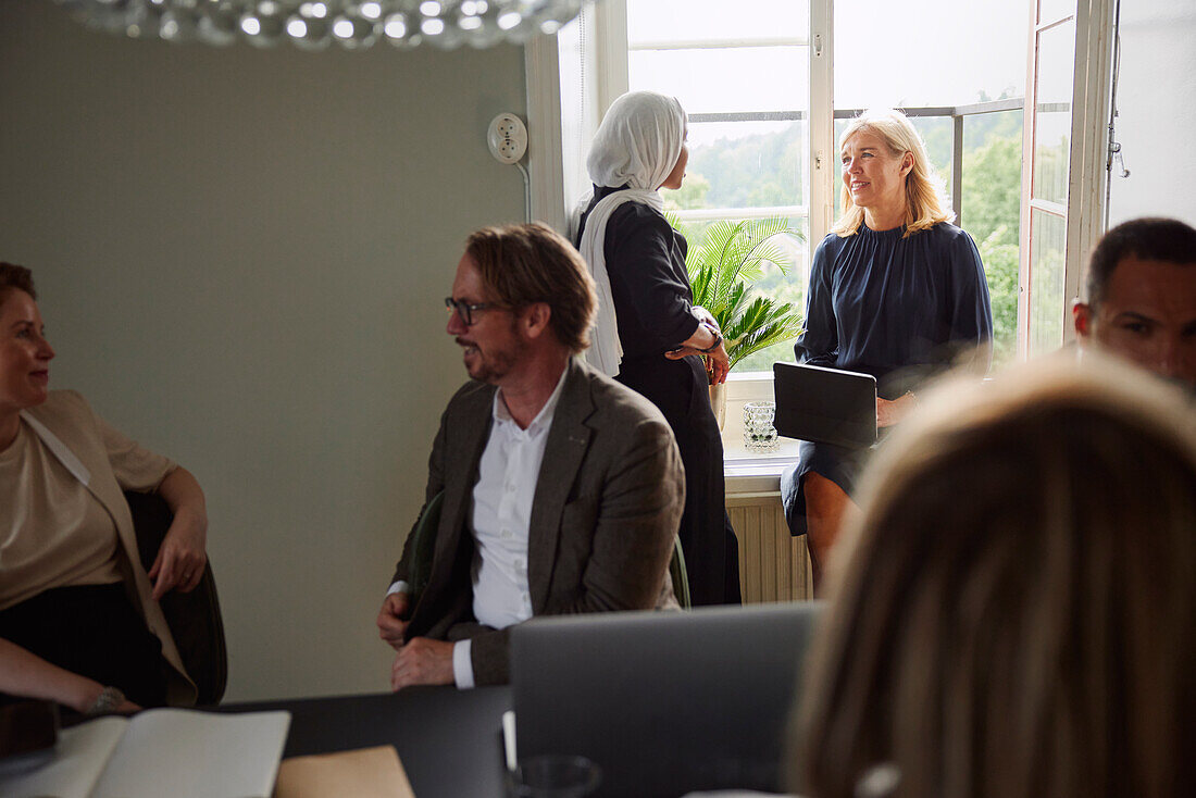 Women talking during business meeting