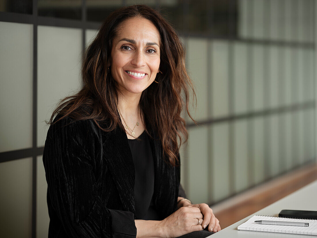 Smiling businesswoman looking at camera