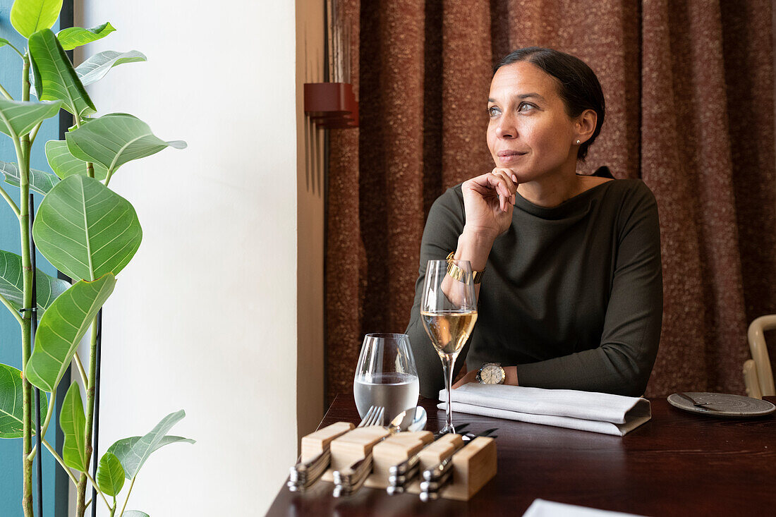 Woman sitting in restaurant