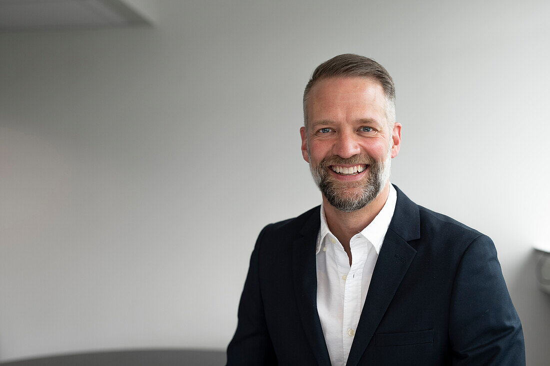 Portrait of businessman looking at camera