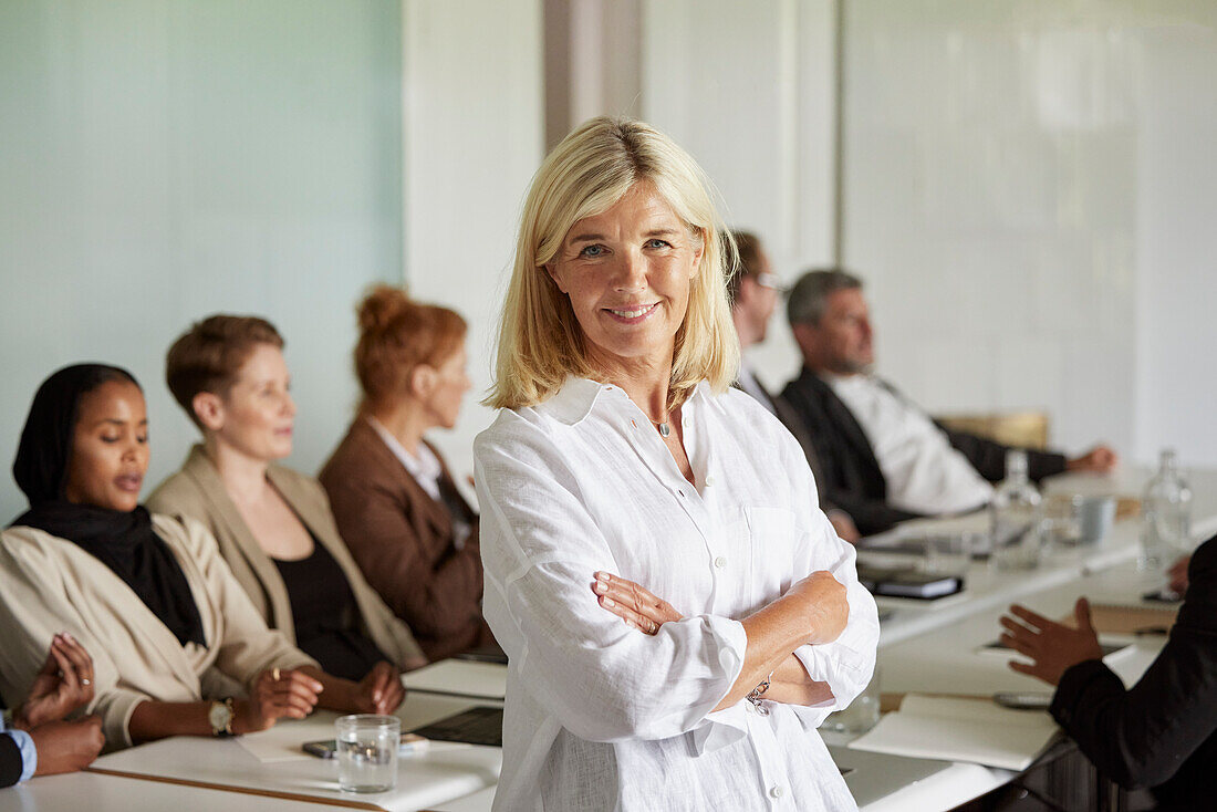 Smiling businesswoman in boardroom