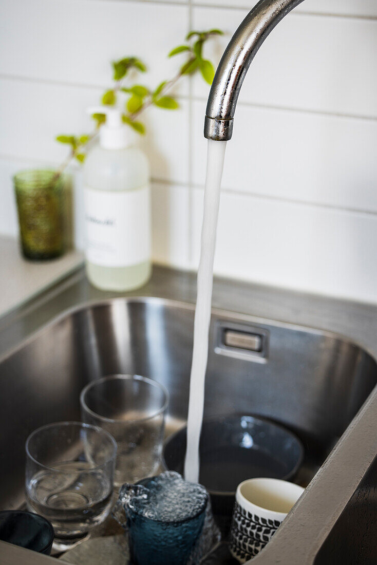 Water running in kitchen sink